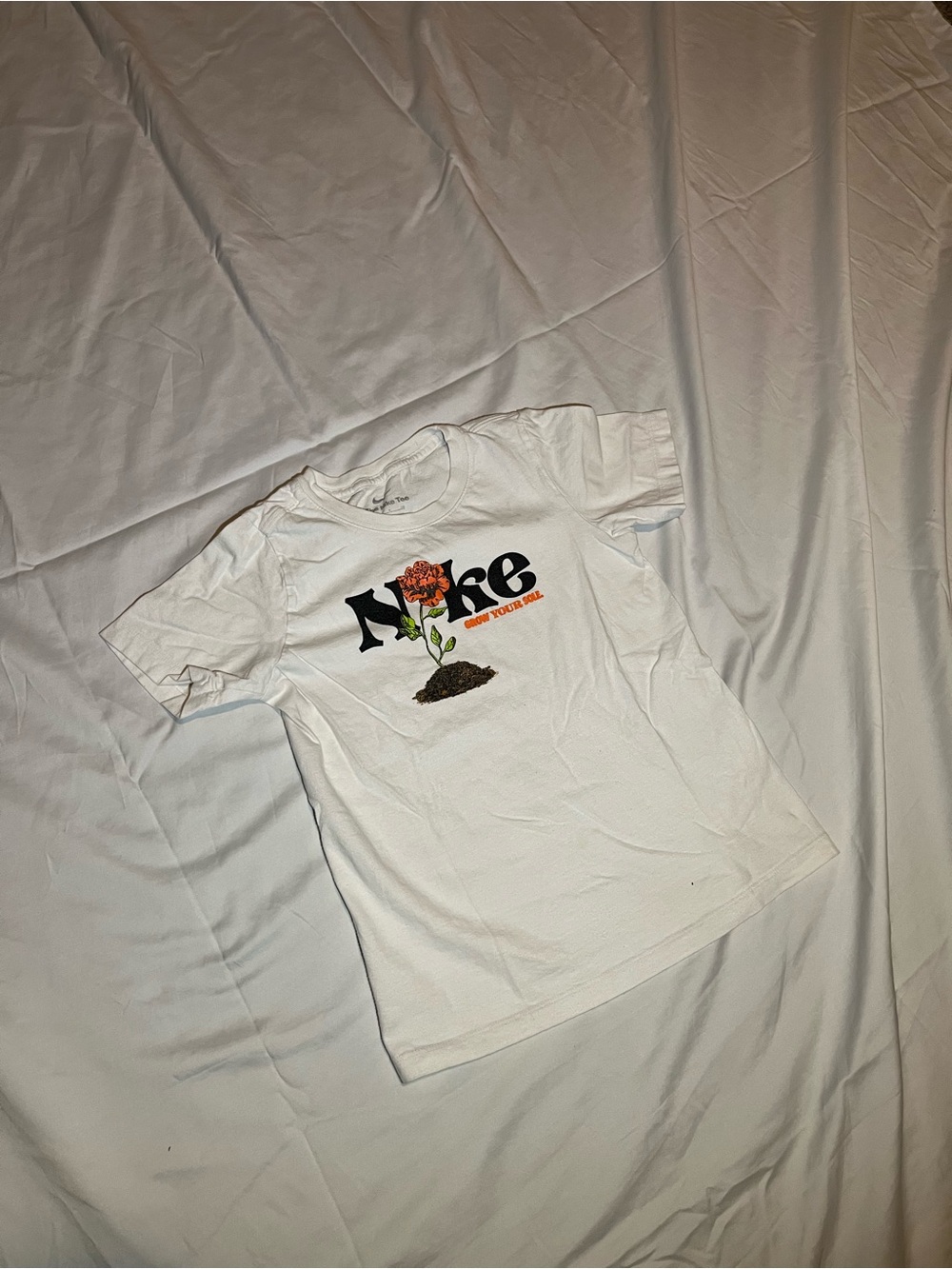 Nike White Tee with Orange Flower Graphic and Black Logo